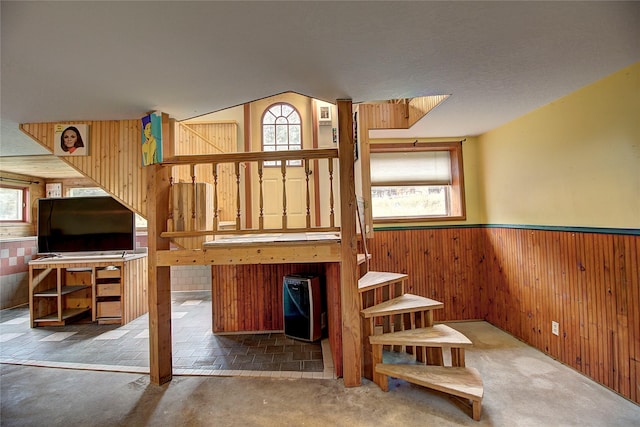 72878 Lemlama Trl, Arlee, MT 59821 - stairway with carpet, wood walls, a healthy amount of sunlight, and wainscoting
