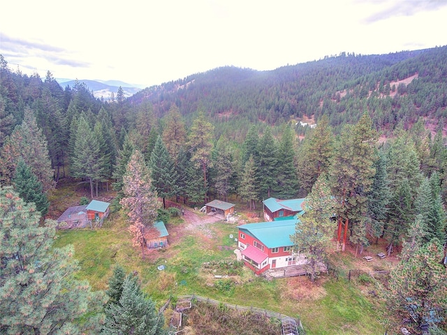 aerial view with a mountain view and a wooded view