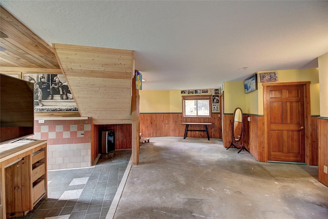 72878 Lemlama Trl, Arlee, MT 59821 - kitchen with concrete flooring, wooden walls, and wainscoting