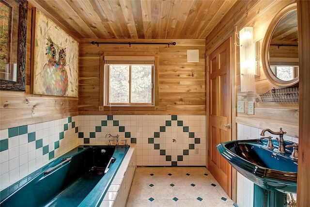 72878 Lemlama Trl, Arlee, MT 59821 - full bath featuring wood ceiling, a sink, a garden tub, wood walls, and tile walls