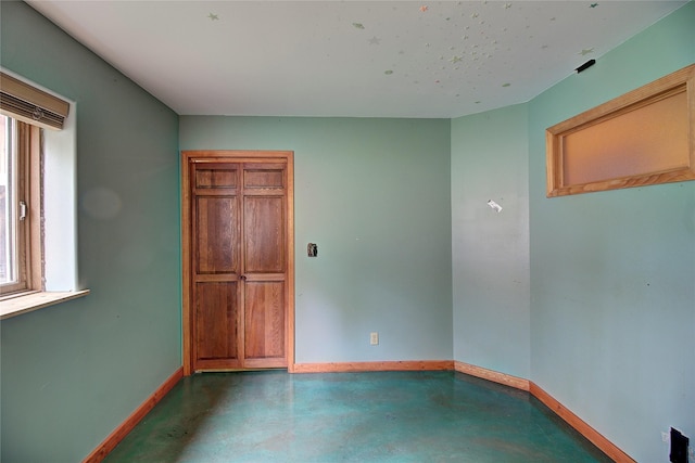 72878 Lemlama Trl, Arlee, MT 59821 - spare room featuring baseboards and finished concrete floors