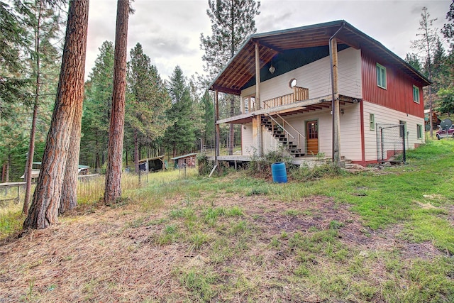 72878 Lemlama Trl, Arlee, MT 59821 - back of house featuring fence, stairway, and a deck