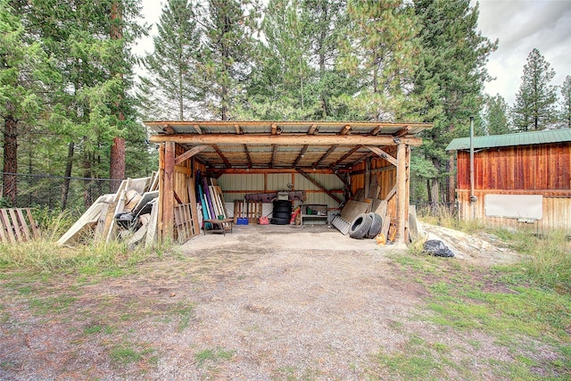 72878 Lemlama Trl, Arlee, MT 59821 - view of pole building featuring driveway, fence, and a carport
