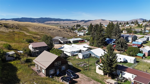 birds eye view of property featuring a mountain view