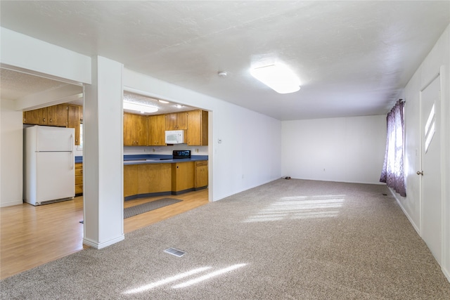 unfurnished living room featuring light hardwood / wood-style flooring