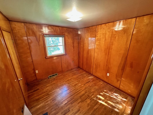 644 4th Ave E, Superior, MT 59872 - spare room featuring wood finished floors and wood walls