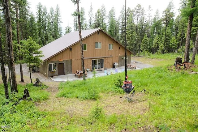 back of property featuring a patio area