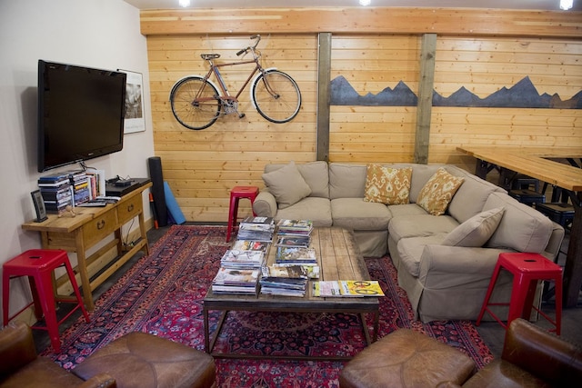 living room featuring wooden walls