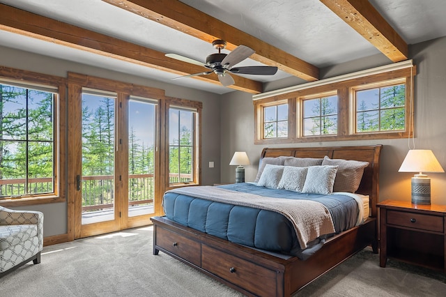 bedroom featuring carpet flooring, ceiling fan, beam ceiling, and access to outside