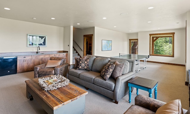 carpeted living room with sink