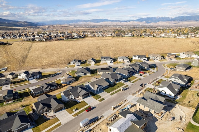 birds eye view of property with a mountain view