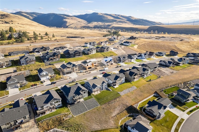 birds eye view of property with a mountain view