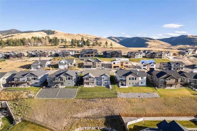 birds eye view of property with a mountain view