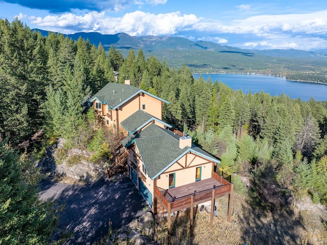 drone / aerial view featuring a water and mountain view