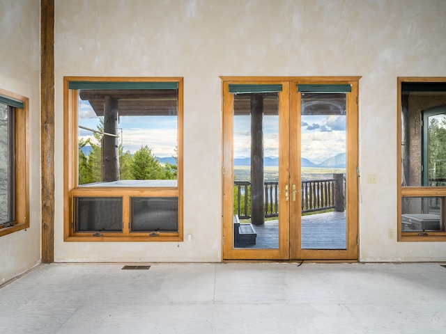 property entrance with a mountain view and french doors