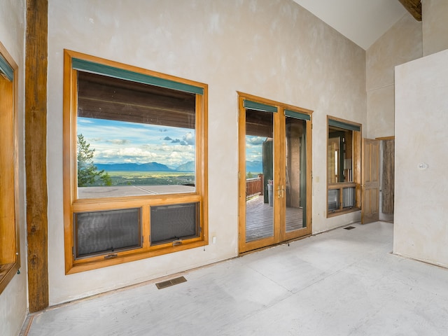 interior space with a mountain view and a patio area