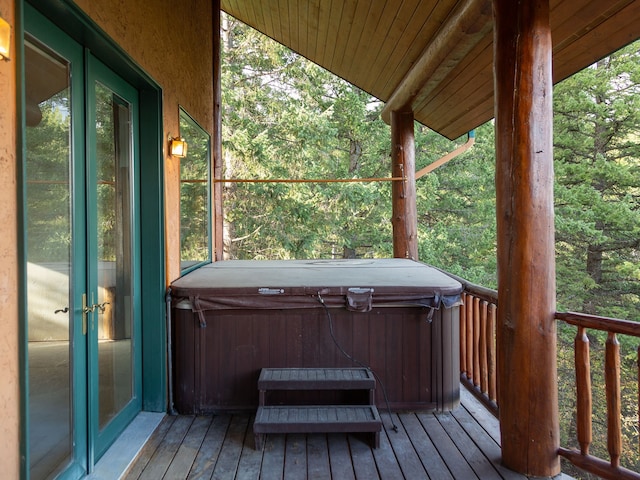 deck with a hot tub