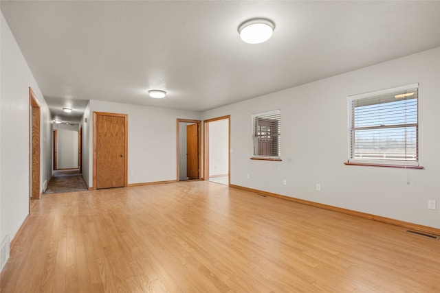 unfurnished room featuring light wood-type flooring