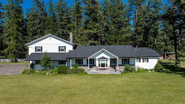 view of front of home featuring a patio and a front lawn