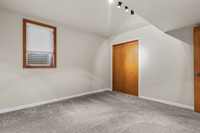 additional living space featuring carpet floors