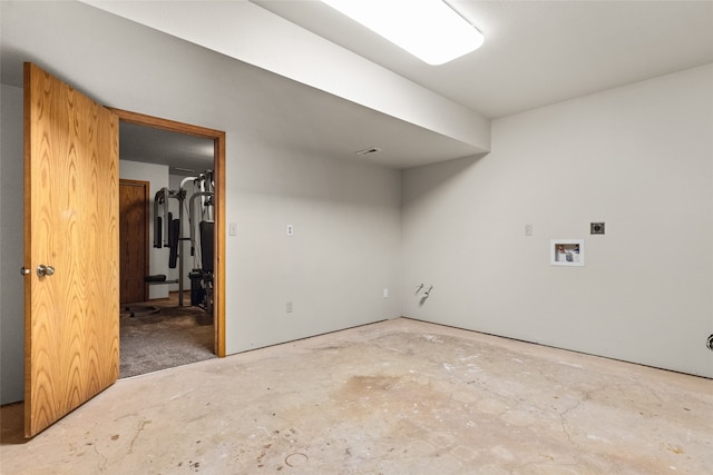 unfurnished room featuring concrete floors