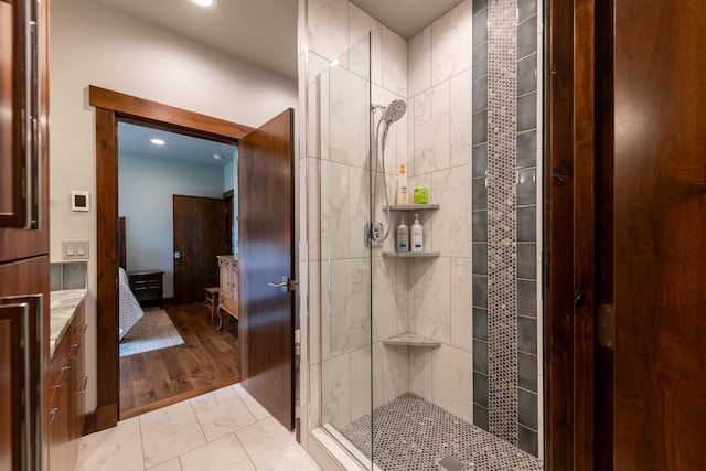 full bathroom with a stall shower, recessed lighting, and marble finish floor