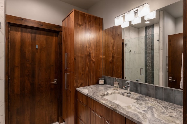bathroom with vanity and a shower stall