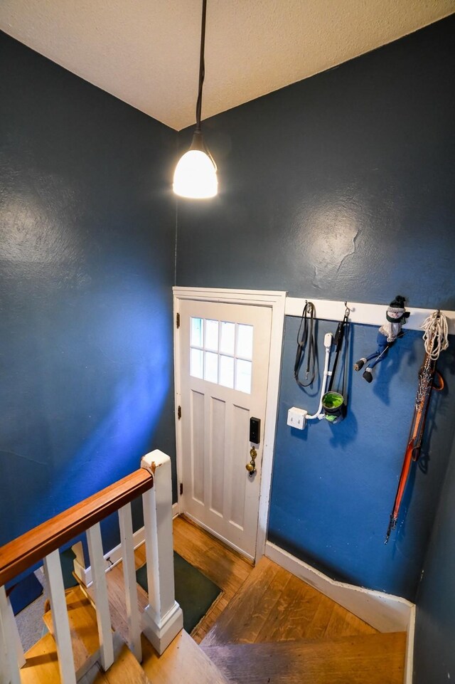 entryway with hardwood / wood-style flooring