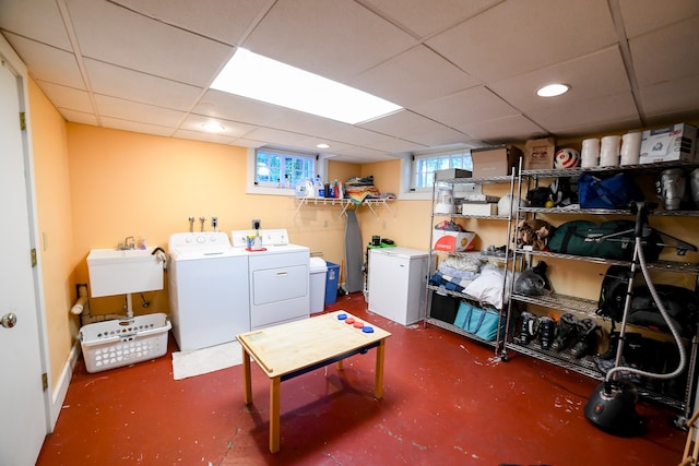 washroom featuring sink and independent washer and dryer