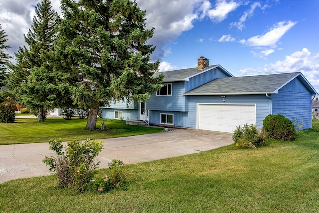 view of front of house featuring a garage and a front yard