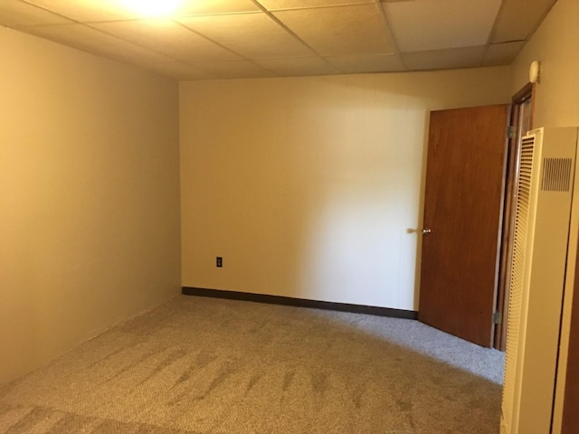 106 State St, Hamilton, MT 59840 - spare room with a heating unit, carpet floors, and a drop ceiling
