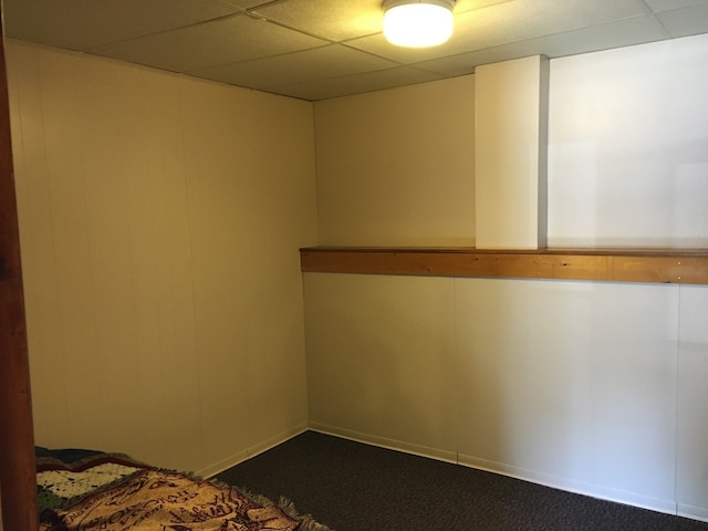 106 State St, Hamilton, MT 59840 - spare room featuring a paneled ceiling and dark carpet