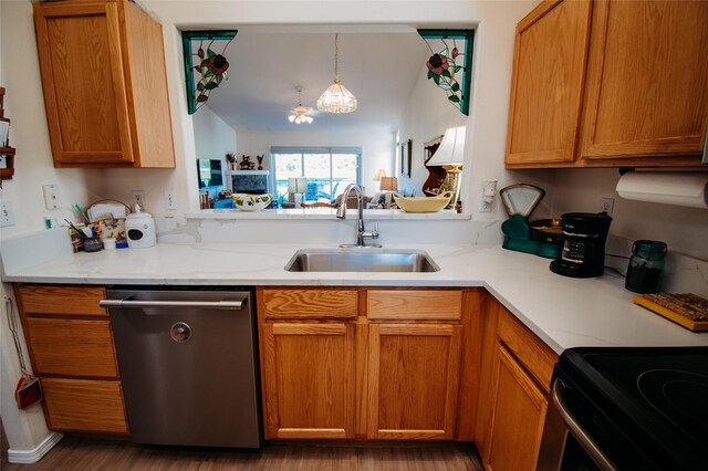 kitchen with dark hardwood / wood-style flooring, dishwasher, hanging light fixtures, and sink