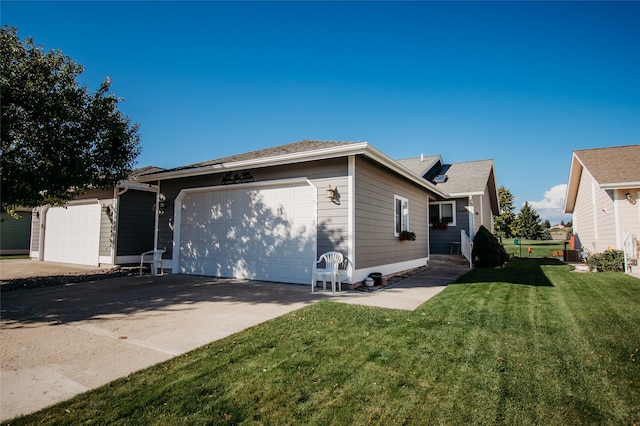 exterior space featuring a garage and a yard