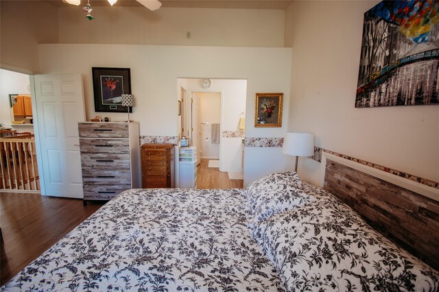 bedroom featuring ceiling fan and dark hardwood / wood-style flooring