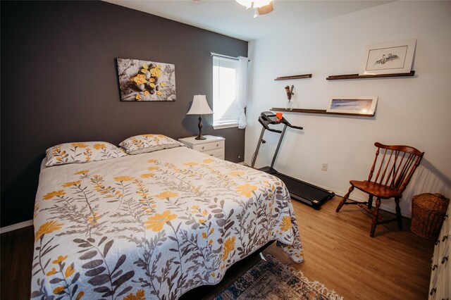 bedroom featuring ceiling fan and hardwood / wood-style flooring