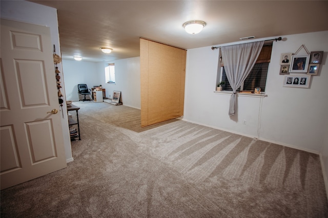 unfurnished room with carpet flooring