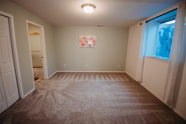 unfurnished bedroom with carpet