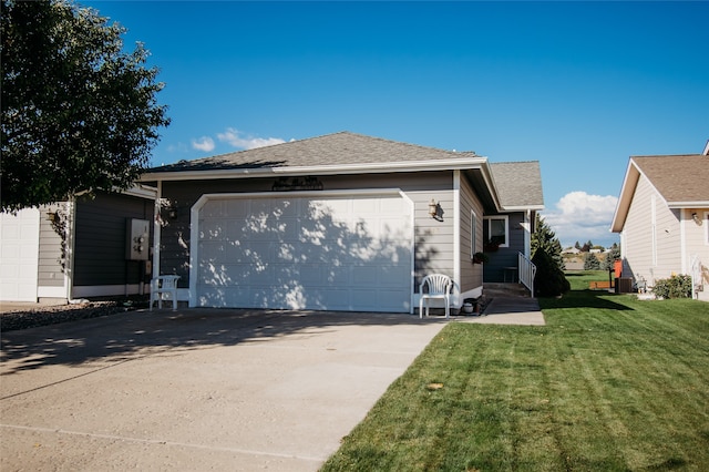 ranch-style home with a front yard and a garage