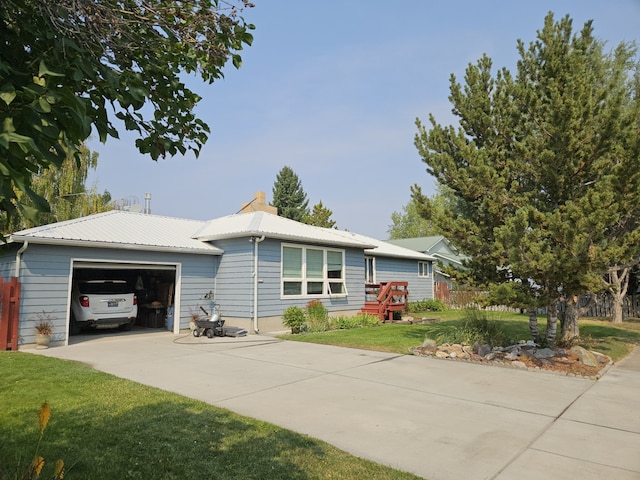 ranch-style house with a garage and a front lawn