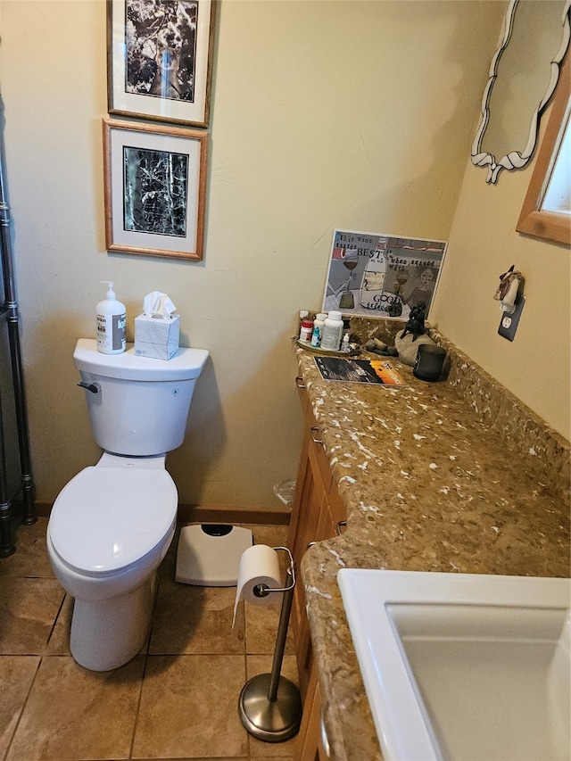 bathroom with tile patterned floors, vanity, and toilet