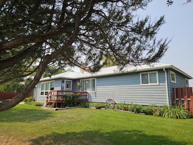 214 Laura St, Augusta, MT 59410 - rear view of house with a wooden deck and a metal roof