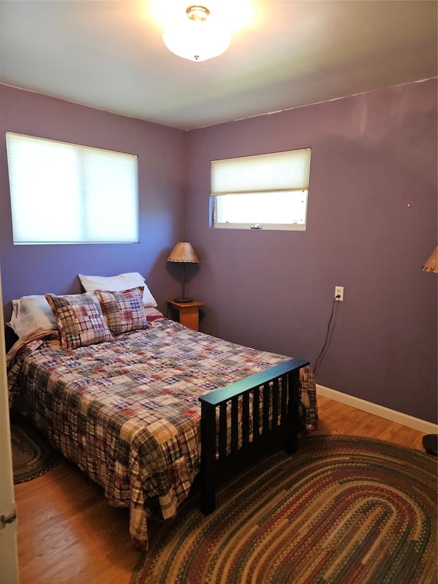 bedroom with wood-type flooring