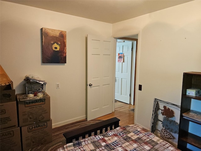 214 Laura St, Augusta, MT 59410 - bedroom featuring baseboards and wood finished floors