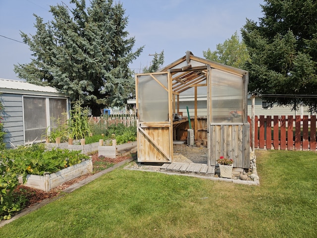 214 Laura St, Augusta, MT 59410 - view of greenhouse with a vegetable garden