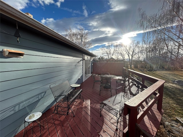 214 Laura St, Augusta, MT 59410 - wooden deck featuring outdoor dining area