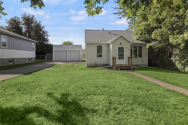 view of front of property with a garage and a front lawn