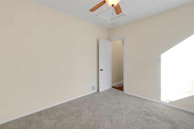 carpeted empty room with ceiling fan