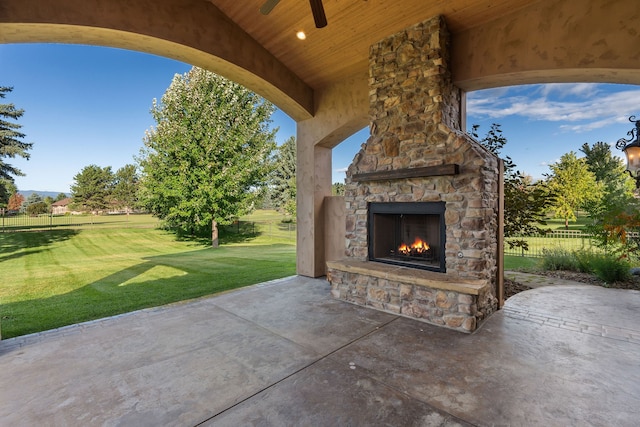 view of patio featuring an outdoor stone fireplace