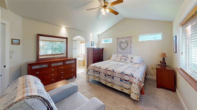 bedroom featuring lofted ceiling, ceiling fan, and light colored carpet